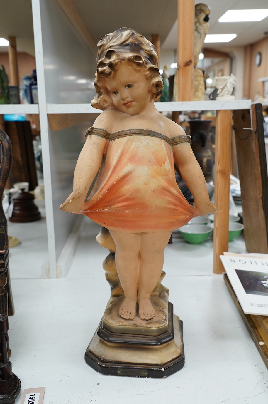 An Art Deco plaster figurine ‘Shy Girl’, 59cm high. Condition - poor to fair